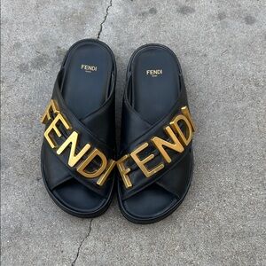 Fendi Black Slides with Gold Accents